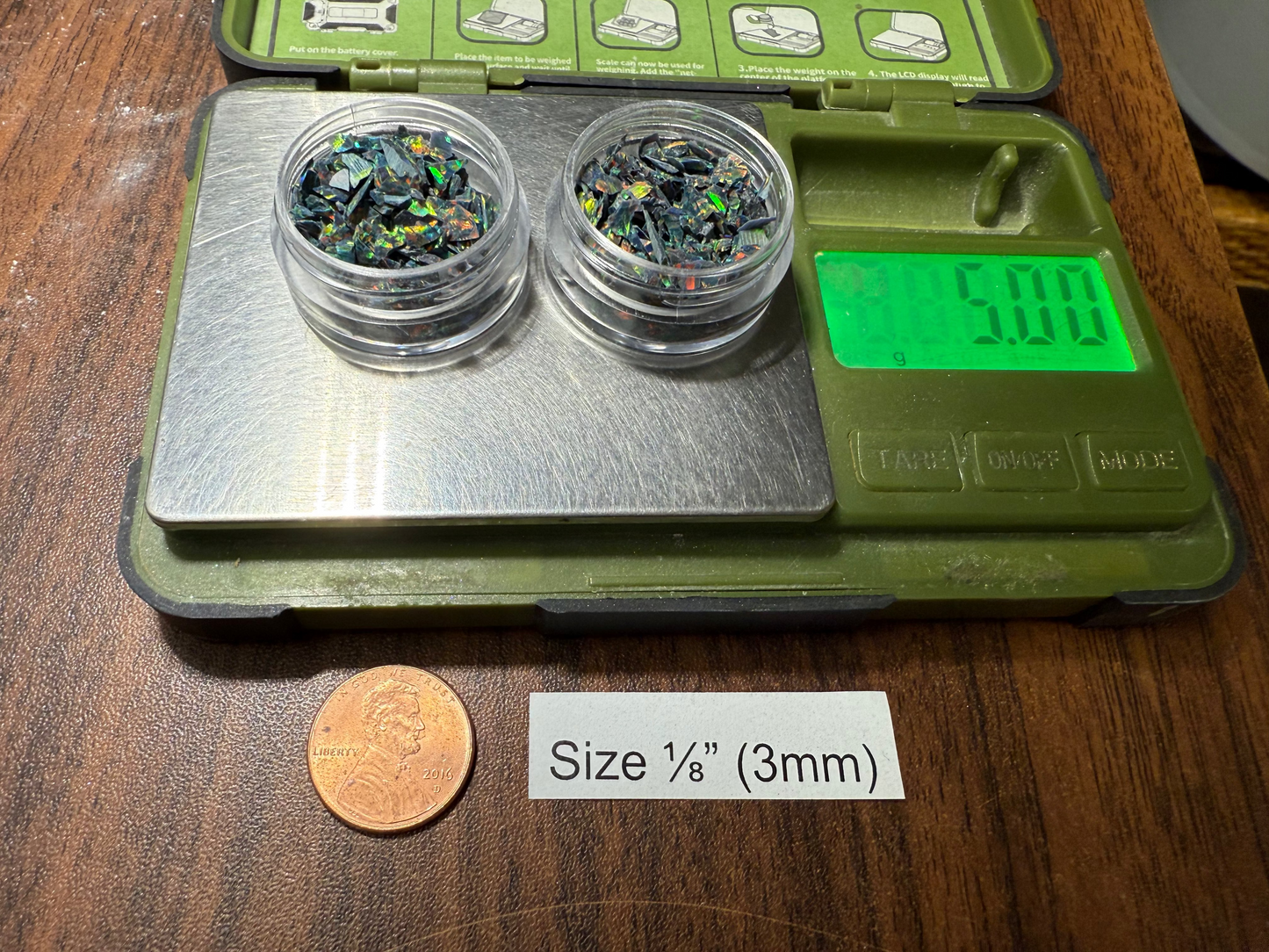 Two small containers with 1/8" opal , showing digital weight measurement.