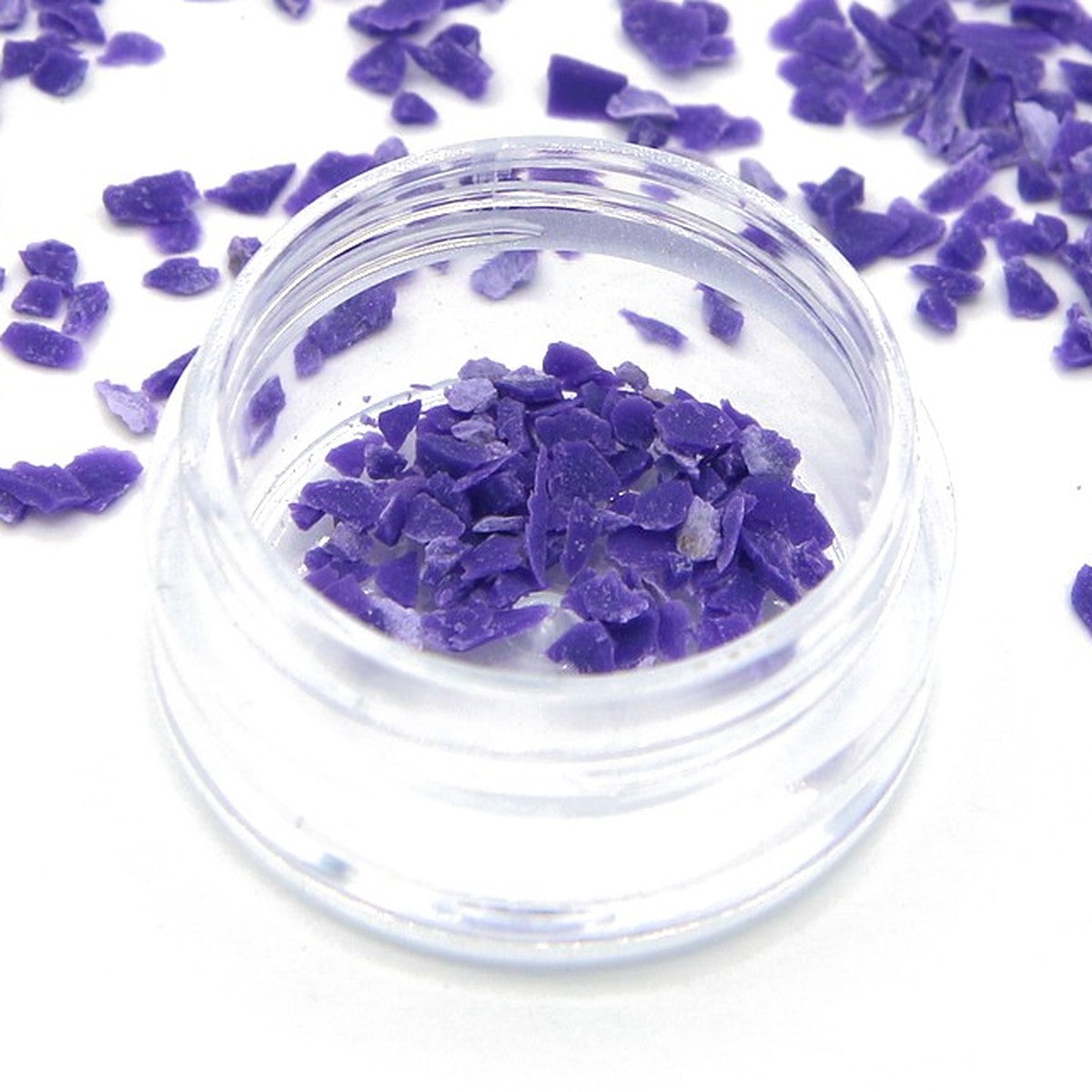 Close-up of purple Colorstone fragments in a small jar