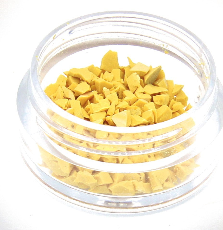 A jar of yellow Colorstone fragments, close up