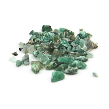 Loose emerald fragments on white