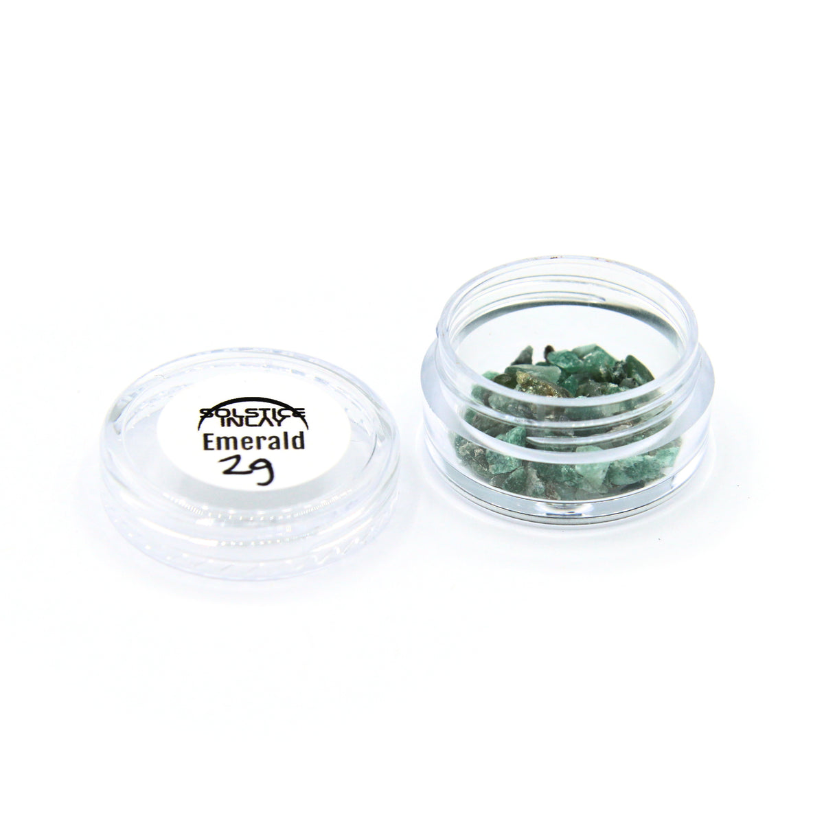 A 2 g jar of emerald fragments with its label