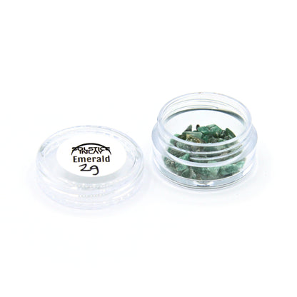 A 2 g jar of emerald fragments with its label