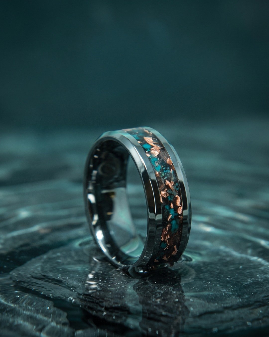 A titanium ring inlaid with opal and copper