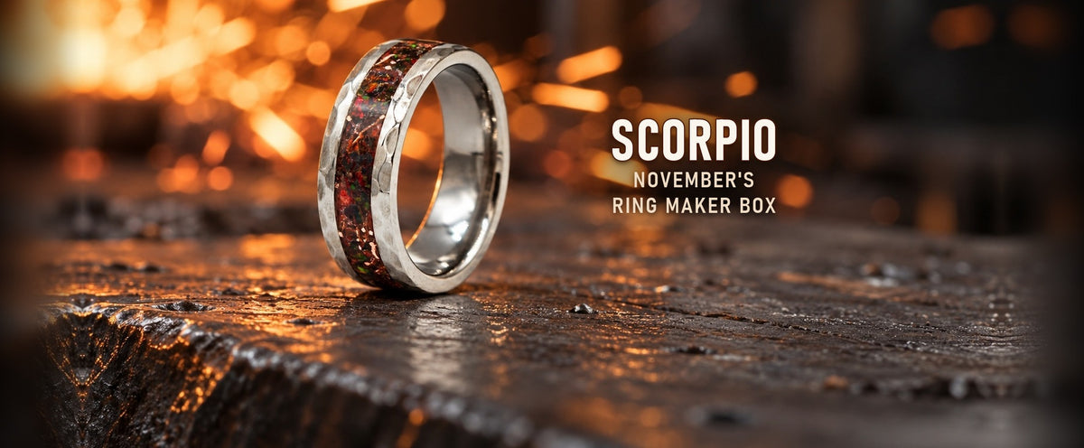 The Scorpio ring on a blacksmith anvil with sparks: the November Ring Maker Subscription Box
