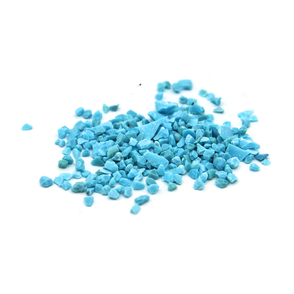 Loose turquoise fragments on white