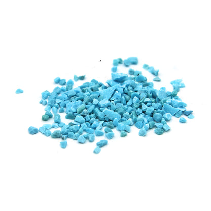 Loose turquoise fragments on white